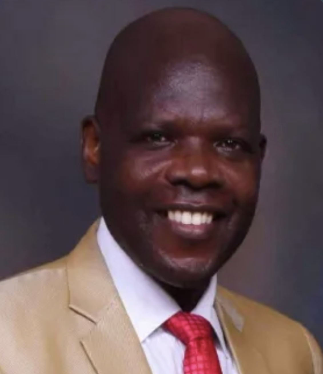 Mr. Wemsley Okuku — Patron